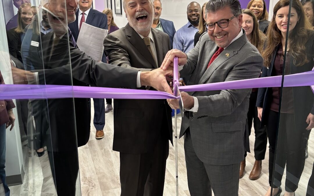 Carl Augusto, Bill Schuldt, and Senator Bucco cut purple ribbon at the door of VLANJ's new Morris Plains, NJ location.